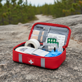 Compact outdoor first aid kit open showing contents